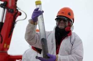 NIU Geology Professor Reed Scherer holds a sediment sample recovered from the grounding zone. Credit: WISSARD