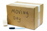 Photo of a moving box, a black Sharpie and packing tape
