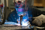 An NIU engineering student welding
